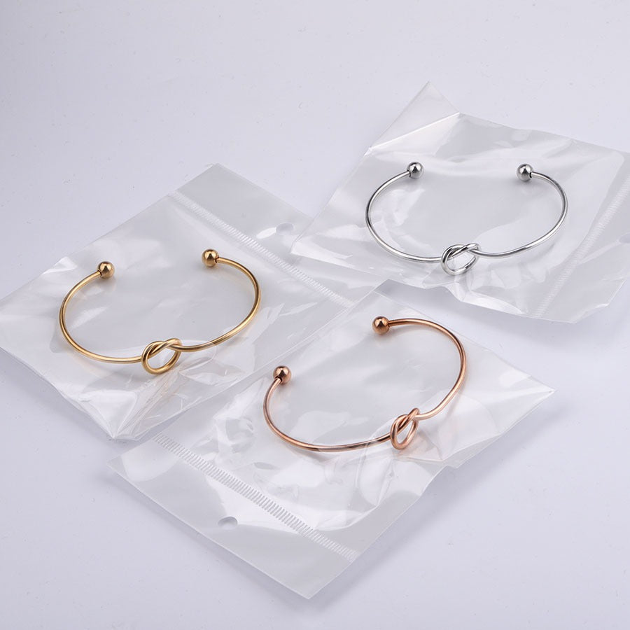 2mm thick stainless steel heart knot bracelet with peach heart shaped opening bracelet bracelet